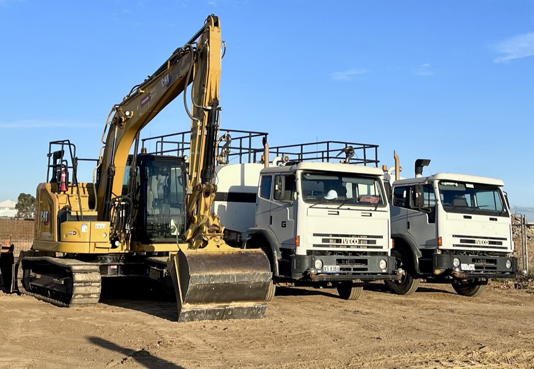 JAWS water carts alongside civil earthmoving equipment